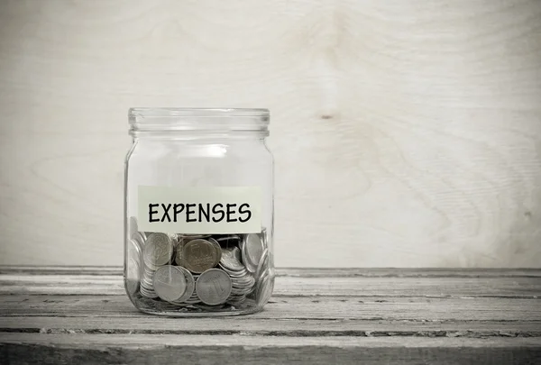 Label on a glass jar with the inscription - expenses — Stock Photo, Image