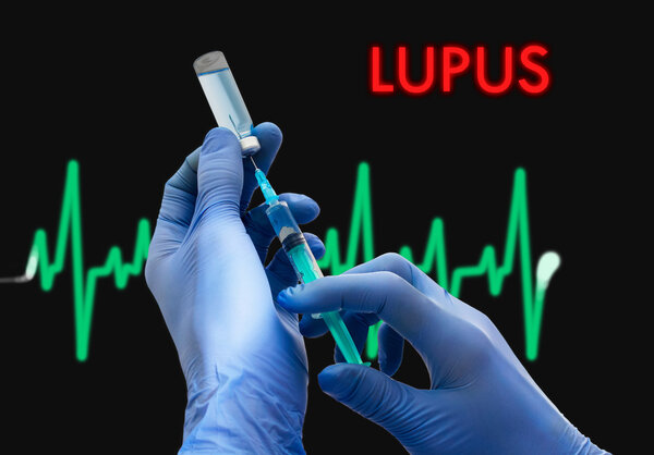Treatment of lupus. Syringe is filled with injection. Syringe and vaccine. Medical concept.