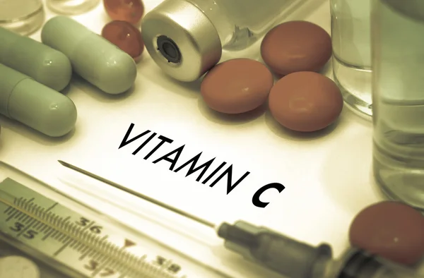 Vitamin c. Treatment and prevention of disease. Syringe and vaccine. Medical concept. Selective focus