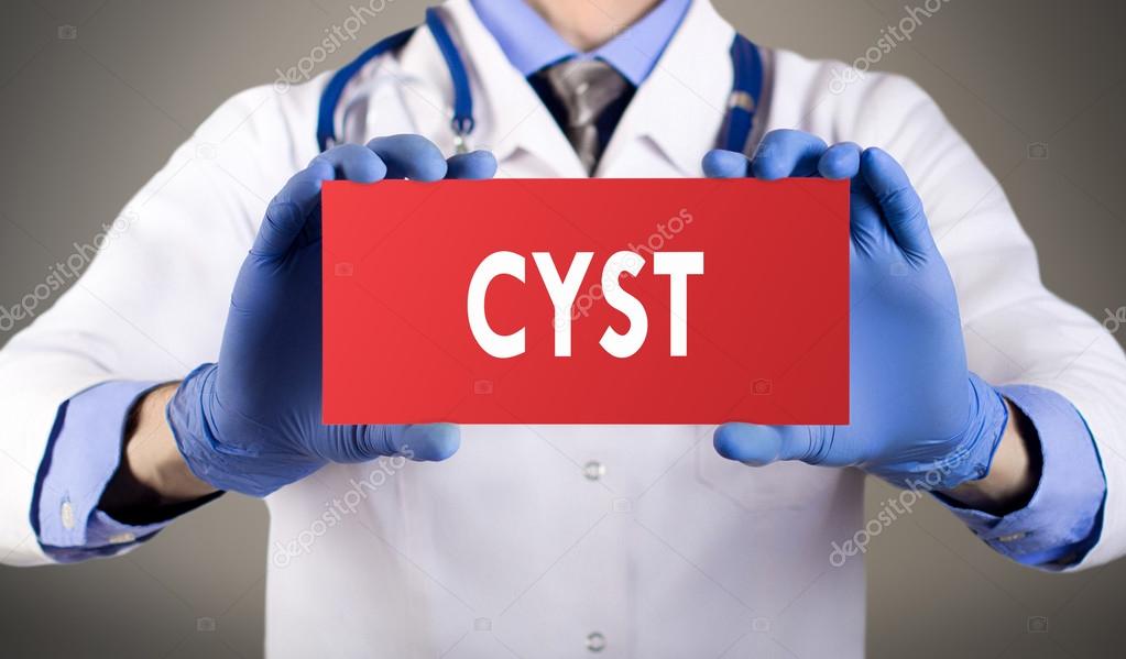 Doctor's hands in blue gloves shows the word cyst. Medical concept.