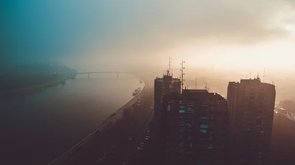 Aerial view on city with heavy mist — Stock Photo, Image