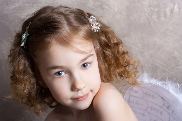 Studio shot of little girl as an angel Royalty Free Stock Images