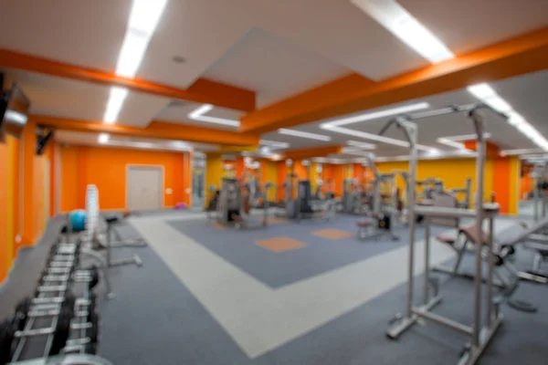 Verschwimmen abstrakten Hintergrund modernen Fitness-Center Lifestyle mit Fitnessgeräten: verschwommene Perspektive Blick Fitnessstudio Einrichtung Service-Raum: leere Turnhalle Innenraum für Ernährung, Bodybuilding-Training — Stockfoto