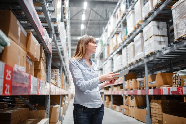 beautiful young furniture store worker stock taking