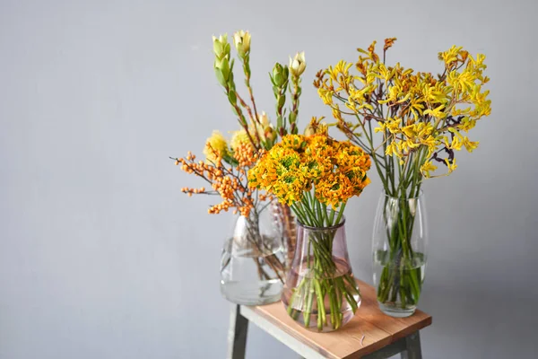 Set of yellow nd orange flowers for Interior decorations. The work of the florist at a flower shop. Fresh cut flower. European floral shop. Delivery fresh cut flower — Stock Photo, Image