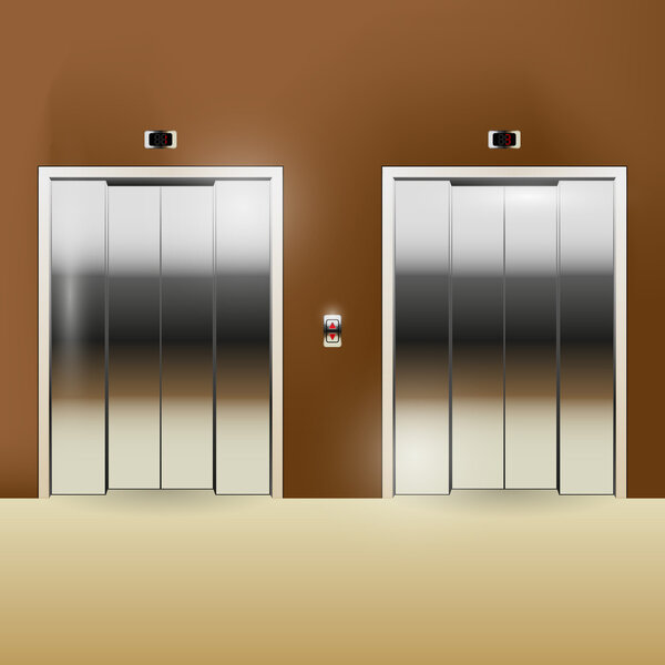 Closed chrome metal office building elevator doors