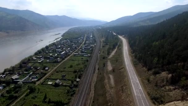 Aerial view of the road through autumn forest Republic Buryatia — Stock Video