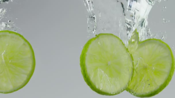 Limes in water — Stock Video