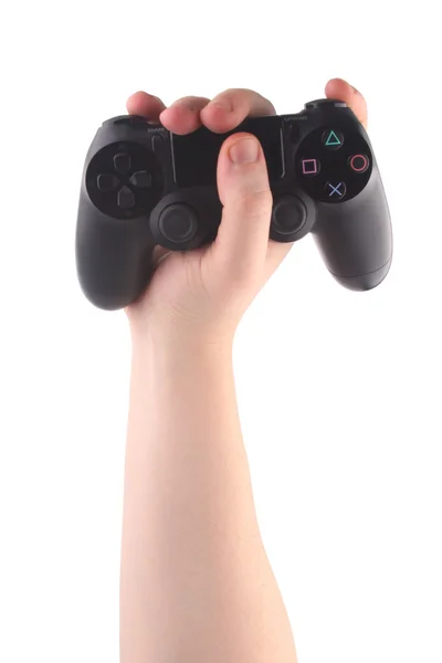 Черная игровая консоль в руке человека вертикально на белом фоне — стоковое фото