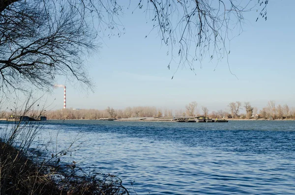 Novi Sad, Serbia - December 08. 2020: Anchored tankers on the Danube River in Petrovaradin, Novi Sad, Serbia