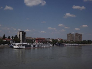 Anchored passenger ships on the promenade by the river Danube in Novi Sad.
