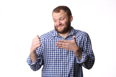 Smiling man shows left hand on his fist right hand