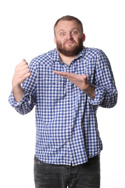 Surprised man shows left hand on his fist right hand