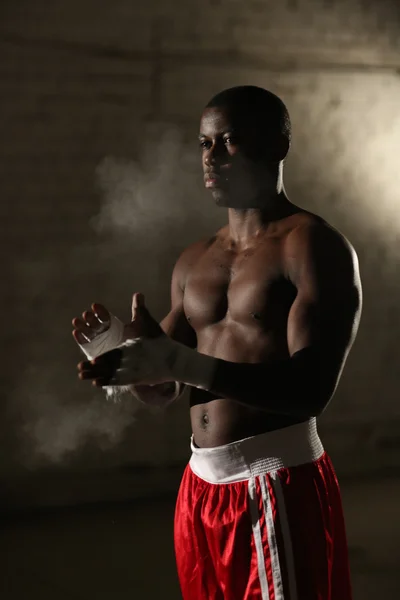 African American male boxer in red shorts at the gym — Stock Photo, Image