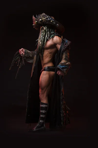 Man with sexy strong muscular body dressed in costume monster — Stock Photo, Image