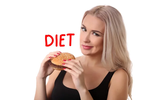 Chica con hamburguesa alta en calorías. De cerca. Fondo blanco — Foto de Stock