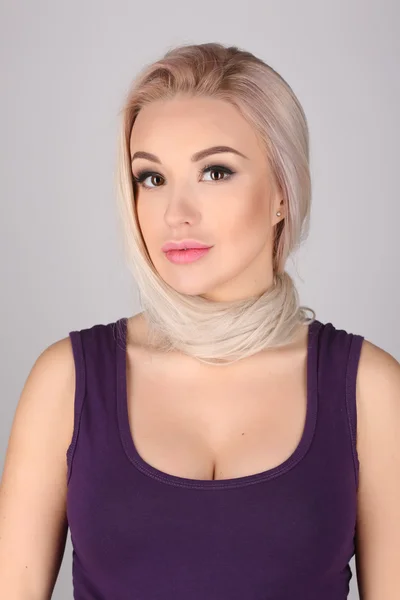 Woman with tied neck by her hair. Close up. Gray background — Zdjęcie stockowe