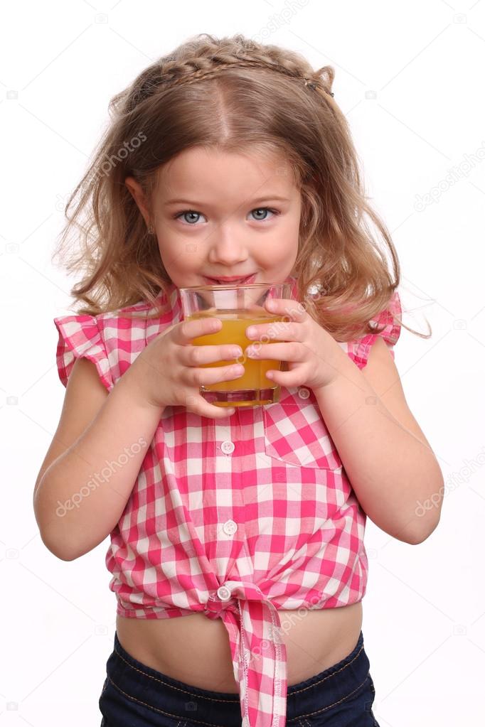 Kid drinking orange juice. Close up. White background