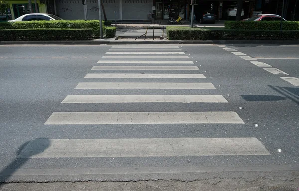 Crosswalk across old road in Thailand - (Selective focus)