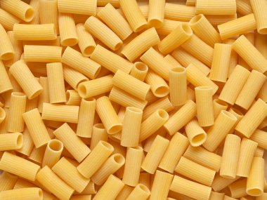 Bir sürü İtalyan makarnasının yakın plan görüntüsü. Tasarımcı için soyut arkaplan.