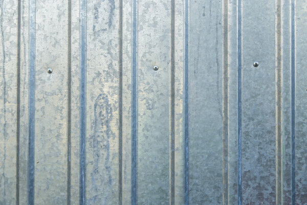 Old blue galvanized metal sheet, background wall