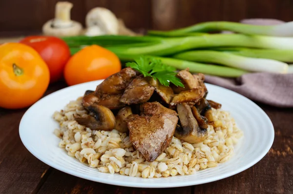 Barley porridge, fried mushrooms and duck liver, boiled quail eggs, tomatoes, arugula - healthy food — Stock Photo, Image