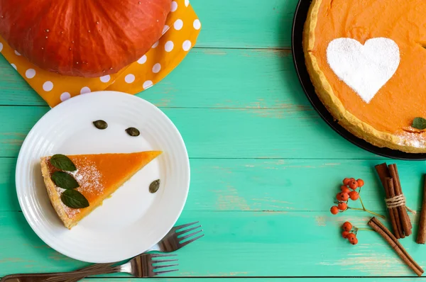 Sweet pumpkin pie. A piece on a white plate. The top view. Dietary vegan dish. Traditional baked for Thanksgiving.