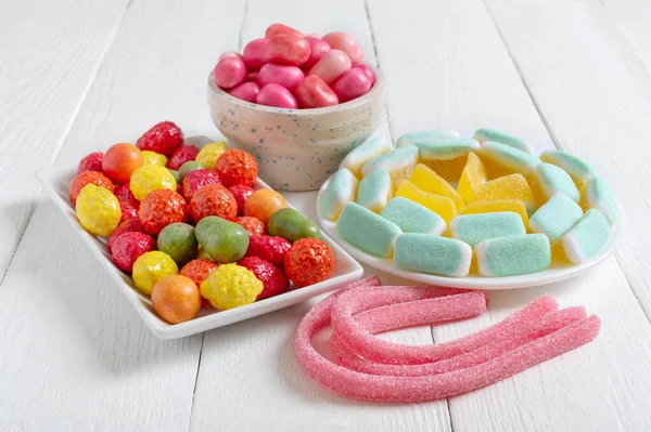 Colourful Chewy Candies Fruit Gum Bowls White Wooden Background Holiday — Stock Photo, Image