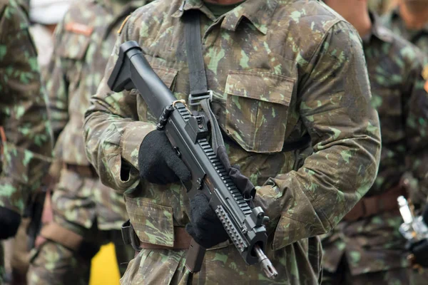 Army soldier with machine gun in hands.