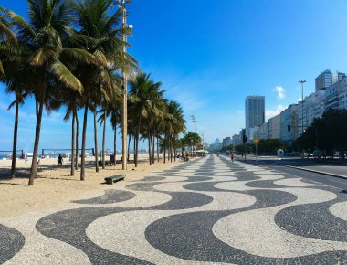 Coconut trees on Copacabana beach Rio de Janeiro Brazil. clipart