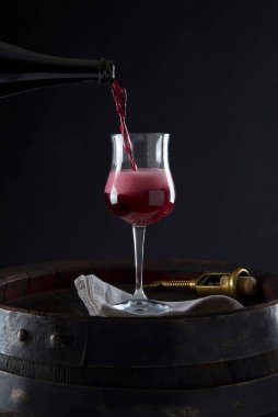 Lambrusco grasparossa poured into the glass with foam and bottle clipart