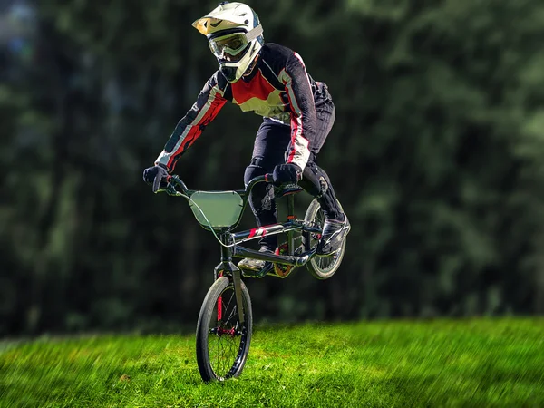 Man riding bmx bike performing a trick — Stock Photo, Image