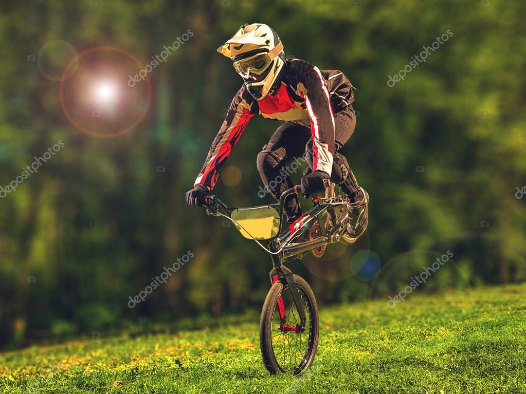 Man riding bmx bike performing a trick — Stock Photo © masisyan 111579280