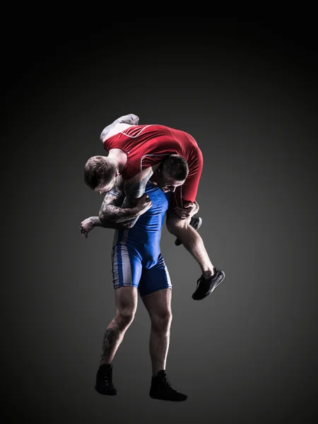 Two freestyle wrestlers in wrestling during training