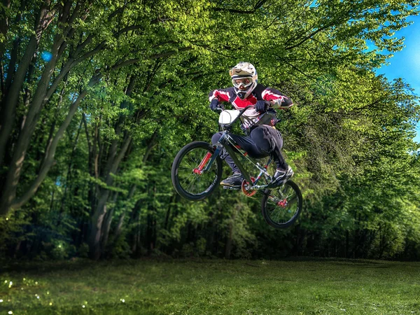 Man riding bmx bike performing a trick