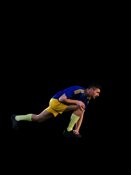 Pemain sepak bola kaukasia beraksi di latar belakang hitam — Stok Foto