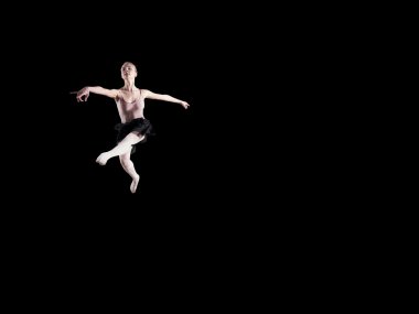 Siyah bir zemin üzerine genç güzel balerin