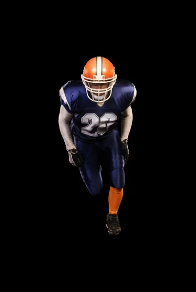 İzole mavi üniformalı profesyonel Amerikan futbolu oyuncusu