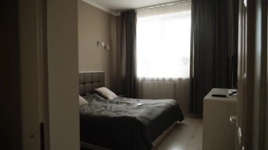 Cozy bedroom tour with natural light and modern decor in a peaceful setting