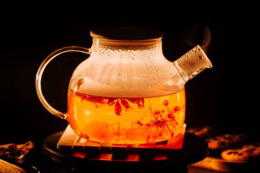 Enjoying the warm essence of black tea in a cozy setting