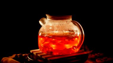 Brewing rich black tea with aromatic flavors in a cozy kitchen setting