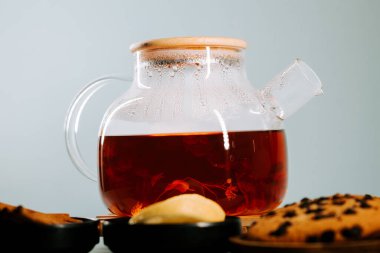 Freshly brewed tea served with sweet treats in a cozy setting