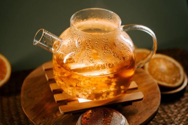 Enjoying green tea in a cozy setting with warm light and fresh ingredients