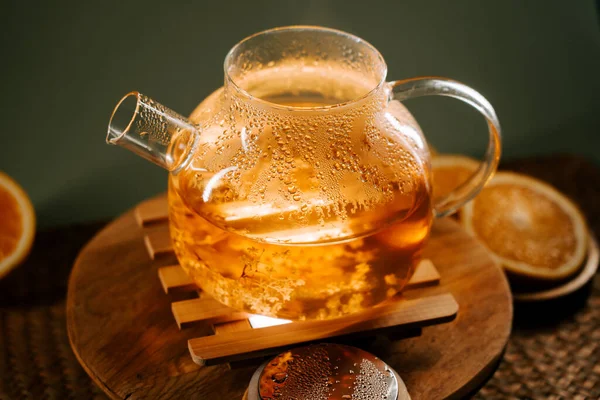 Enjoying green tea in a cozy setting with warm light and fresh ingredients