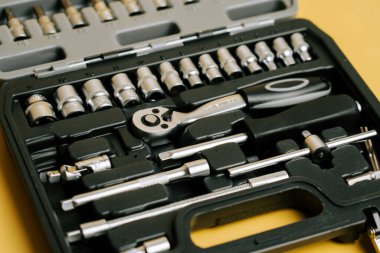 Tool set with various sockets and ratchet for home repair tasks