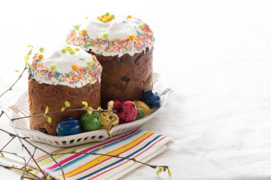 Russian easter cakes Kulich with dyed quail eggs