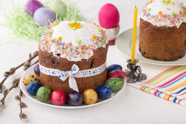 Russian easter cakes Kulich with dyed quail eggs