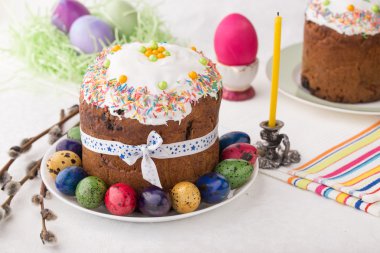 Russian easter cakes Kulich with dyed quail eggs