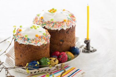 Russian easter cakes Kulich with dyed quail eggs