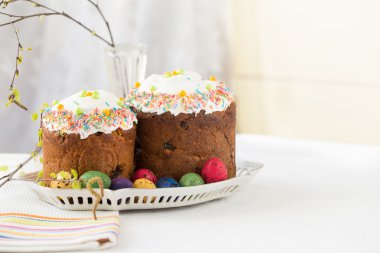 Russian easter cakes Kulich with dyed quail eggs